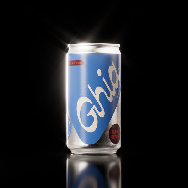 Ghia Le Spritz Blood Orange alcohol-free aperitif blue can lit on a black background