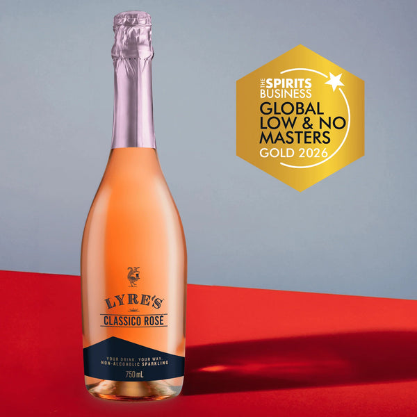 Bottle of Lyre's Classico Rosé on a red and gray background next to a gold Spirits Business Global Low & No Masters 2026 award medallion.