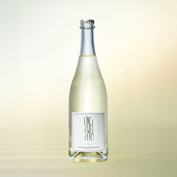 Leitz Eins Zwei Zero Sparkling Blanc de Blancs non-alcoholic wine bottle on cream background