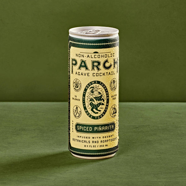 PARCH Spiced Pinarita alcohol-free agave cocktail, single 8.4 oz can on a green background
