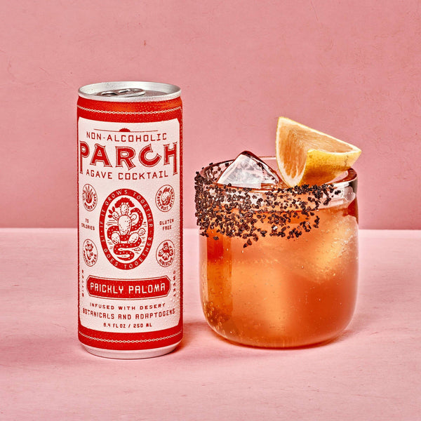 PARCH Prickly Paloma alcohol-free agave cocktail can beside a spice-rimmed glass with ice and grapefruit