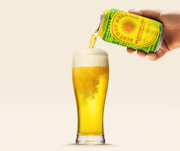 Best Day Brewing Electro-Lime non-alcoholic beer poured from can into a pint glass