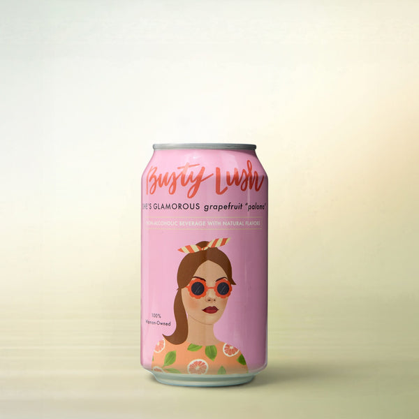 Busty Lush She's Glamorous Grapefruit Paloma, alcohol-free cocktail, can on a soft gradient background