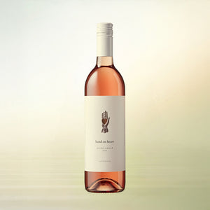 Hand on Heart Rosé non-alcoholic wine, 750 ml bottle on cream background