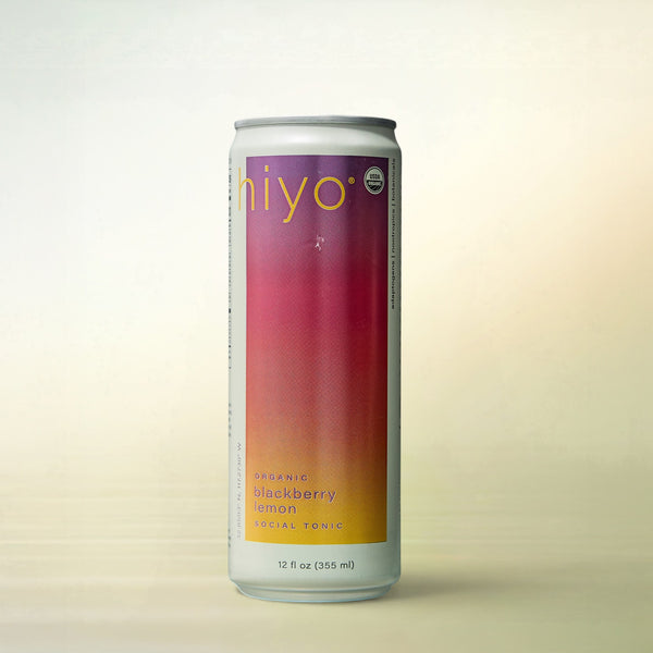 hiyo Blackberry Lemon Seltzer, alcohol-free functional wellness beverage, can on a soft gradient background