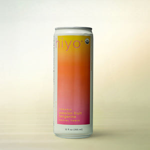 hiyo Passionfruit Tangerine, alcohol-free functional wellness beverage, can on a soft gradient background