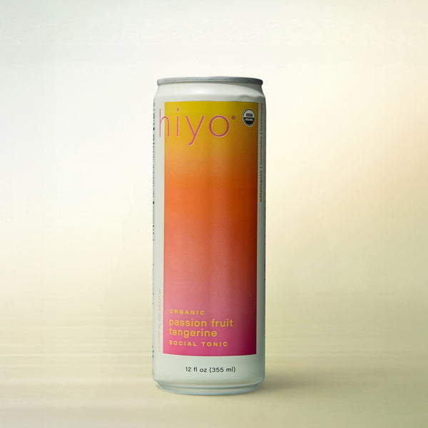 hiyo Passionfruit Tangerine, alcohol-free functional wellness beverage, can on a soft gradient background
