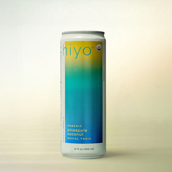 hiyo Pineapple Coconut, alcohol-free functional wellness beverage, can on a soft gradient background