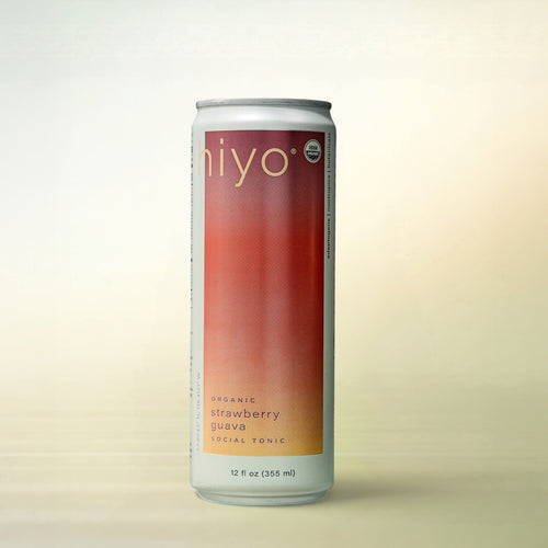 hiyo Strawberry Guava with Organic Adaptogens, alcohol-free functional wellness beverage, can on a soft gradient background
