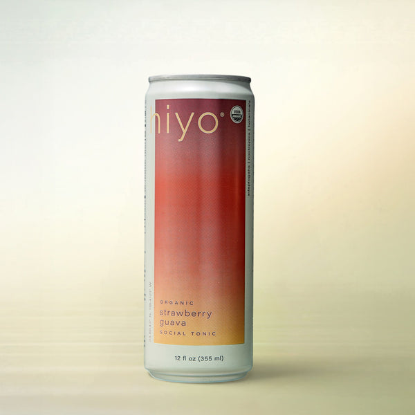 hiyo Strawberry Guava with Organic Adaptogens, alcohol-free functional wellness beverage, can on a soft gradient background