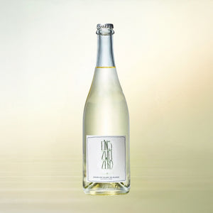 Leitz Eins Zwei Zero Sparkling Blanc de Blancs non-alcoholic wine bottle on cream background