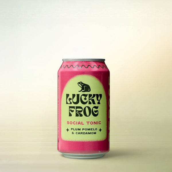 Lucky Frog Beverages Plum Pomelo, alcohol-free, can on a soft gradient background