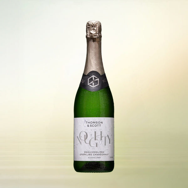 Noughty Sparkling Chardonnay non-alcoholic wine bottle on cream background