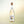 Wölffer Estate Spring in a Bottle Blanc de Blanc non-alcoholic wine bottle on cream background