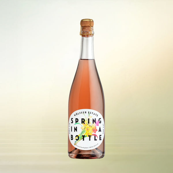 Wölffer Estate Spring in a Bottle Rosé non-alcoholic wine bottle on cream background